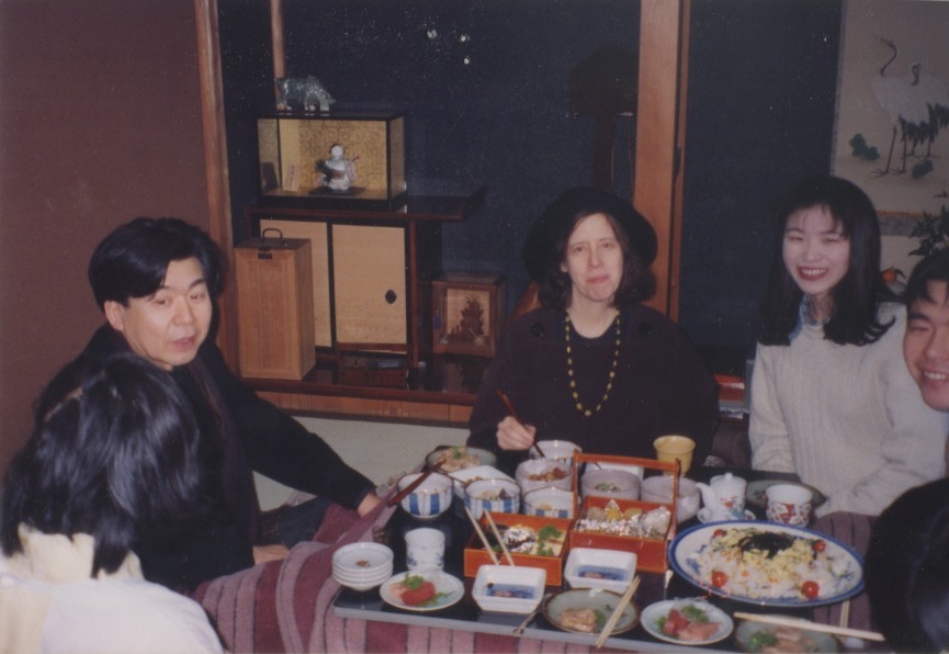 Arakawa and Madeline with friends at a meal in Japan