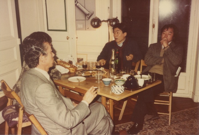 Arakawa with a group of men at a party